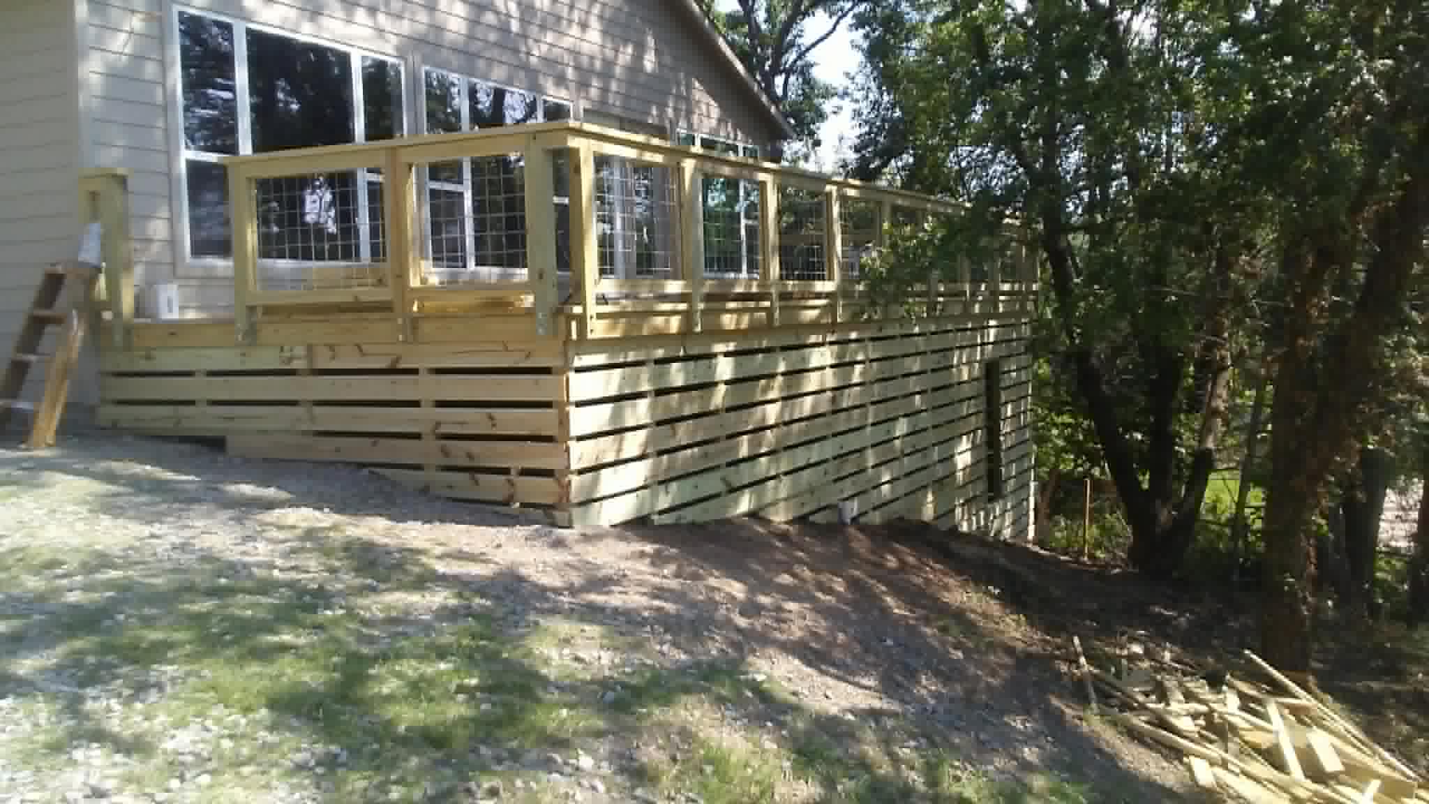 Custom deck with wire panel railing side view