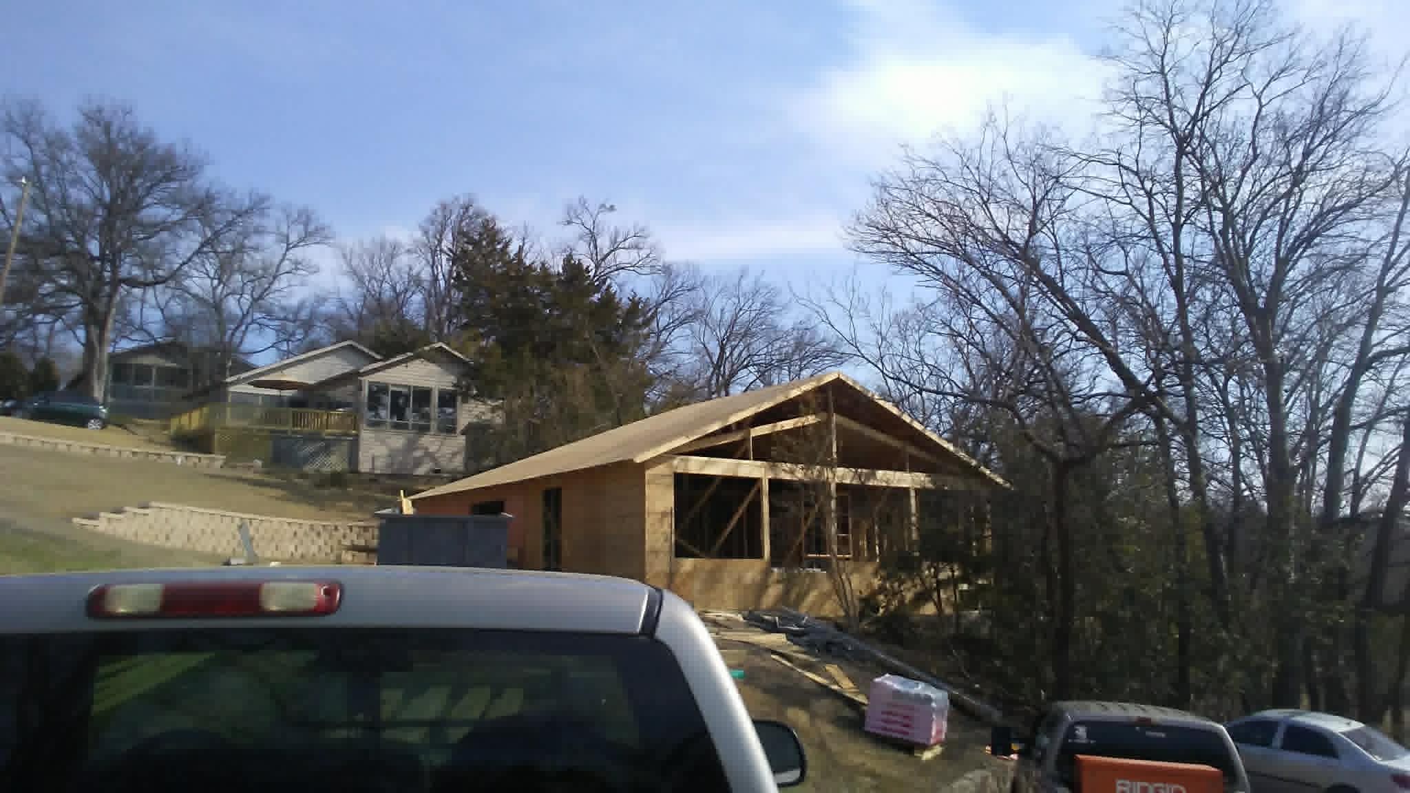Home framing with sheathing near lakefront