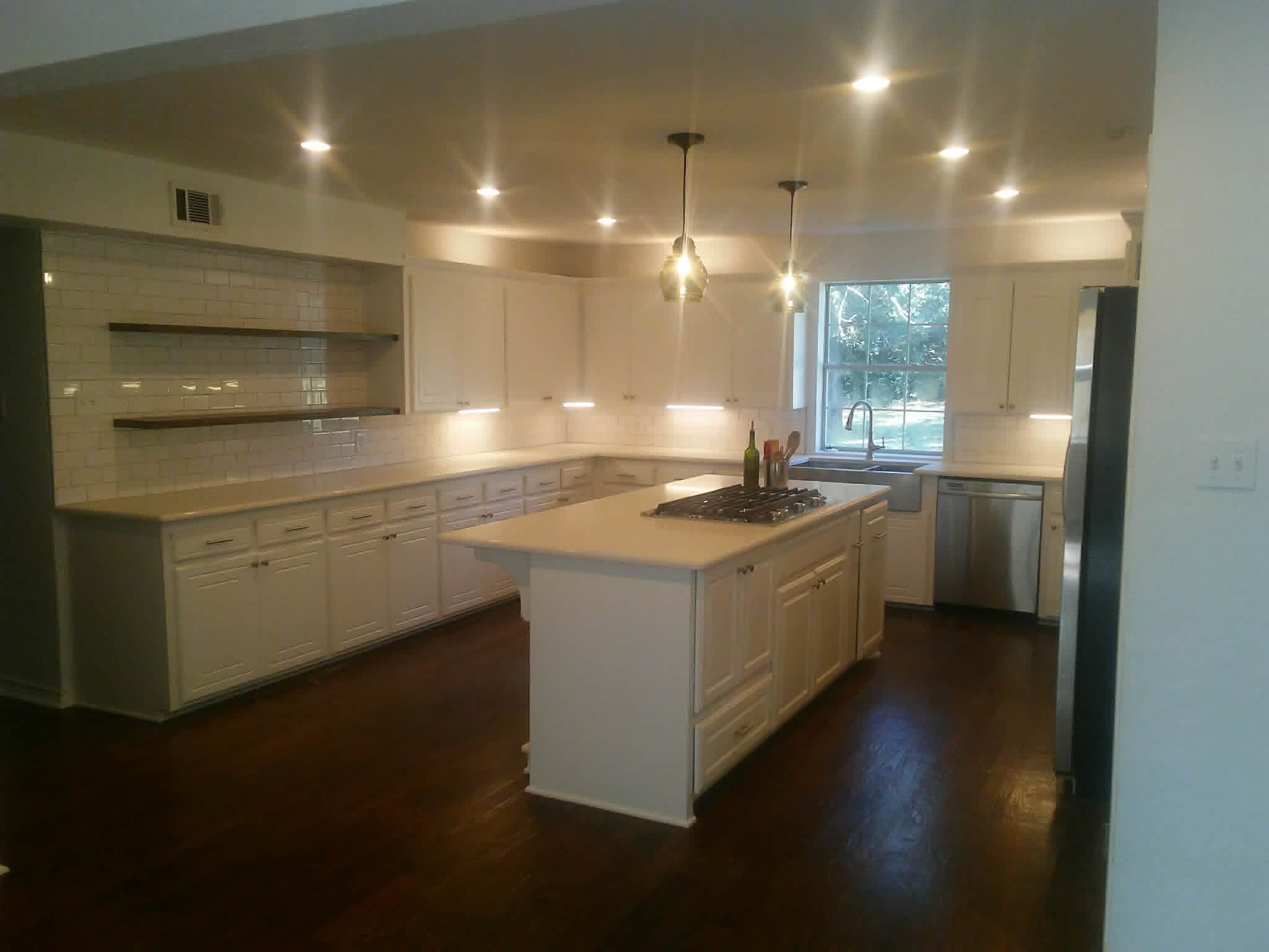 Kitchen featuring white cabinets and subway tile backsplash