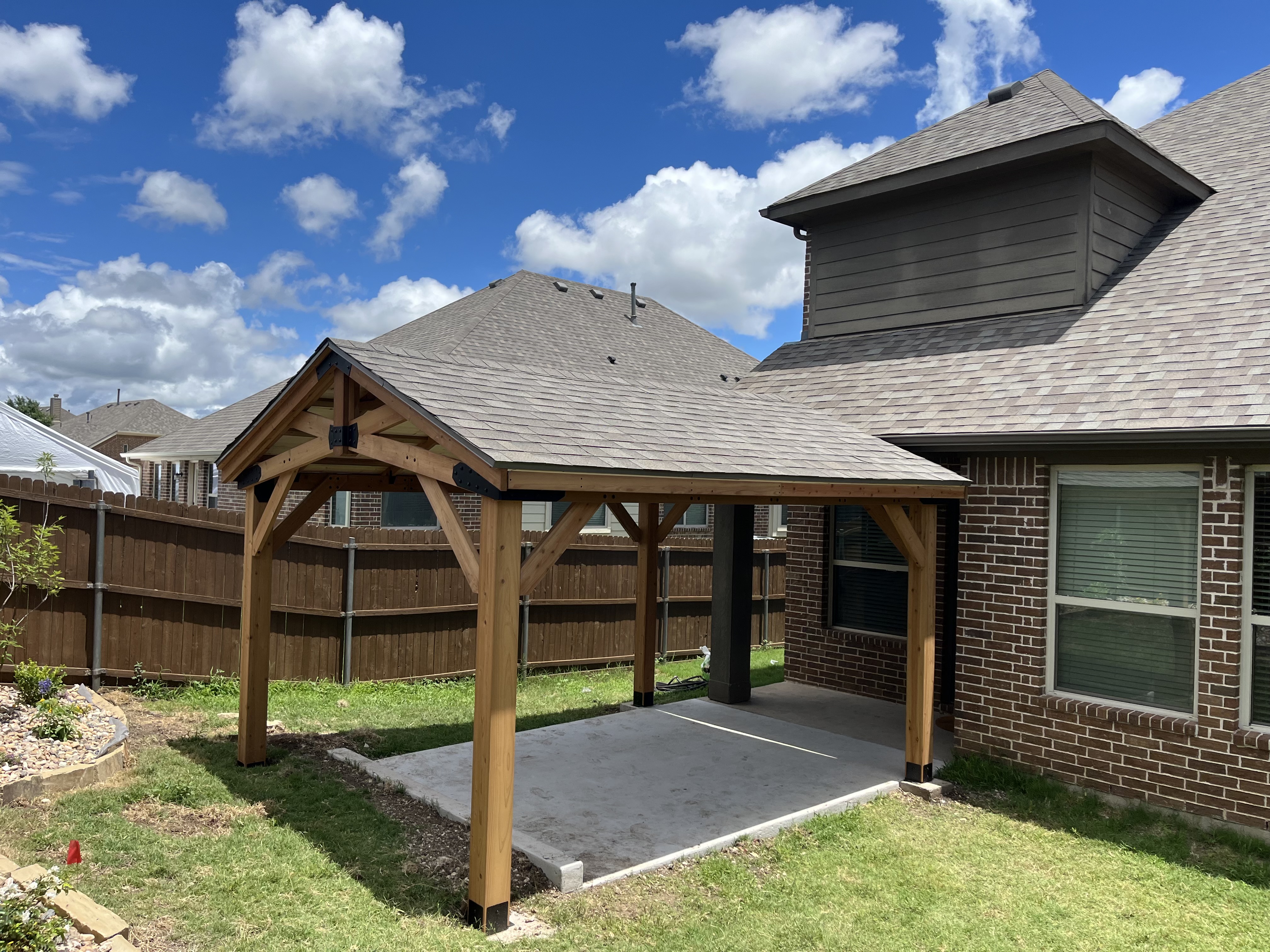 Cedar backyard pavilion patio cover over concrete slab