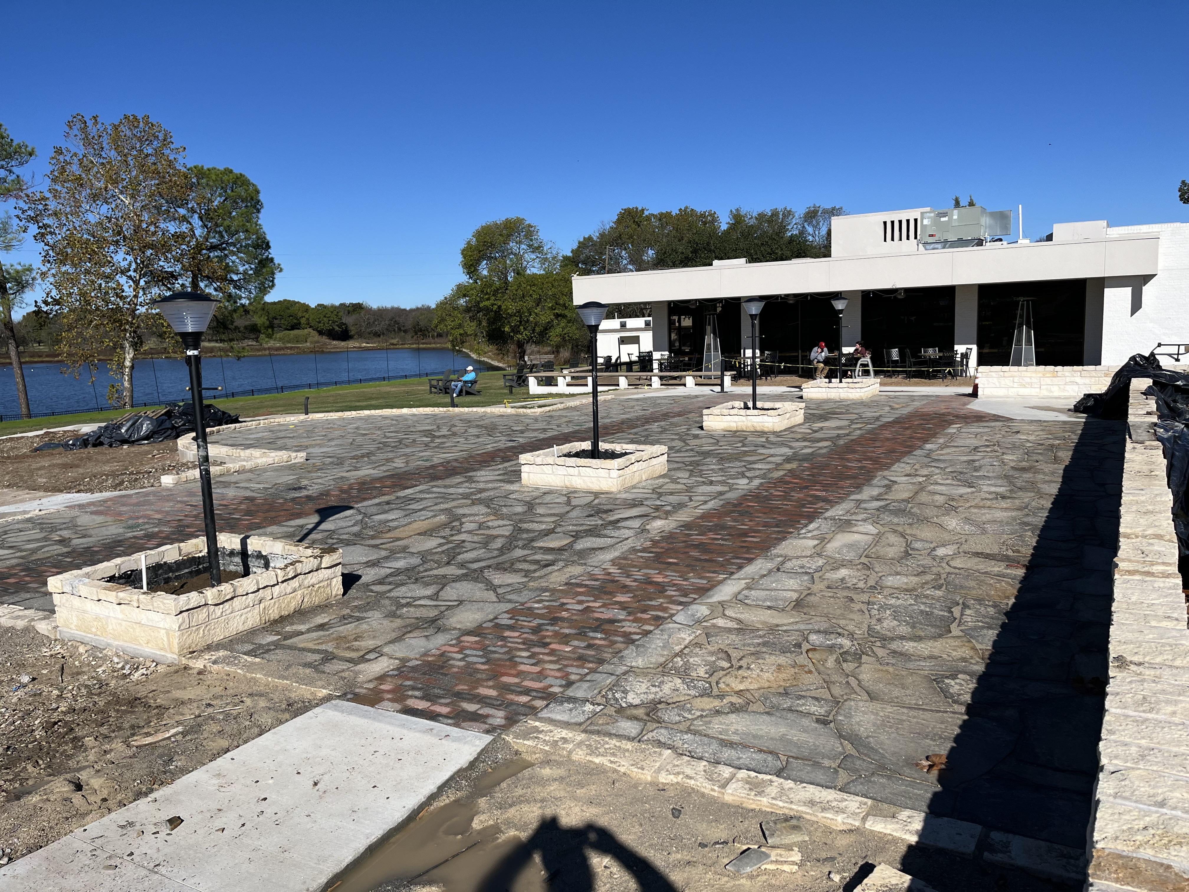 Finished lakeside stone and brick patio plaza